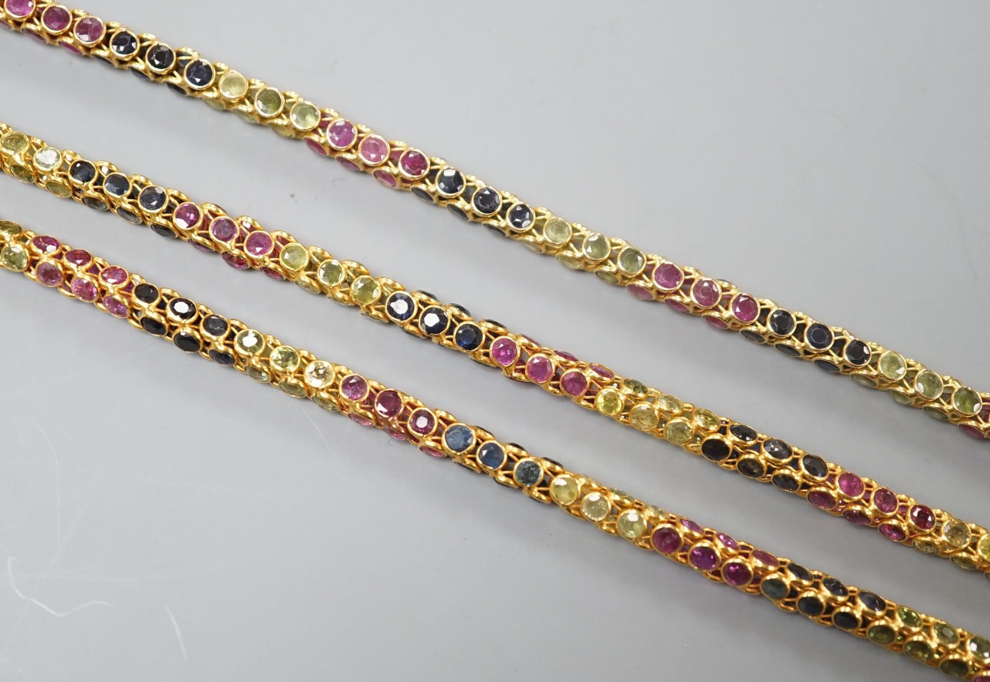 A modern Thai yellow metal and multi gem set necklace, 68cm and a similar bracelet stamped 585, 17.5cm, gross weight 35 grams.